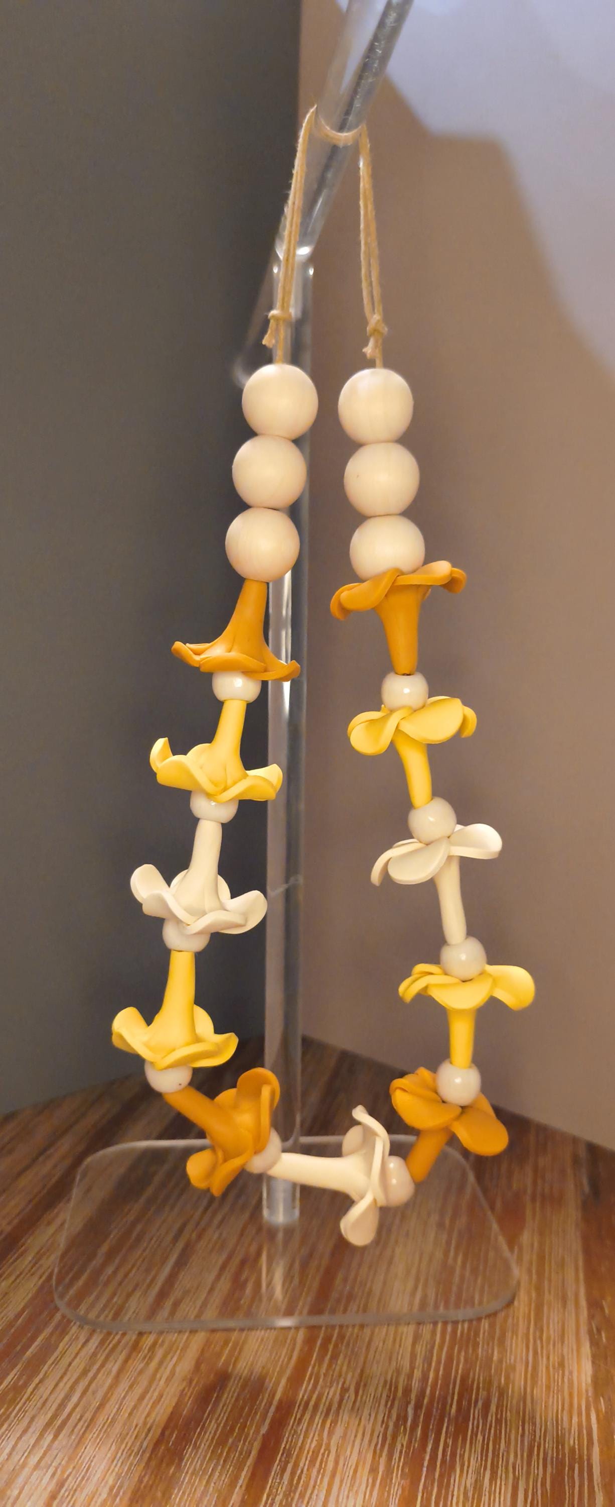 Car lei with handmade clay puakenikeni