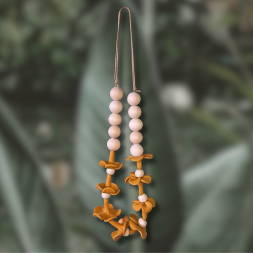 Car lei with handmade clay puakenikeni