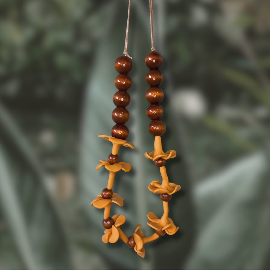 Car lei with handmade clay puakenikeni