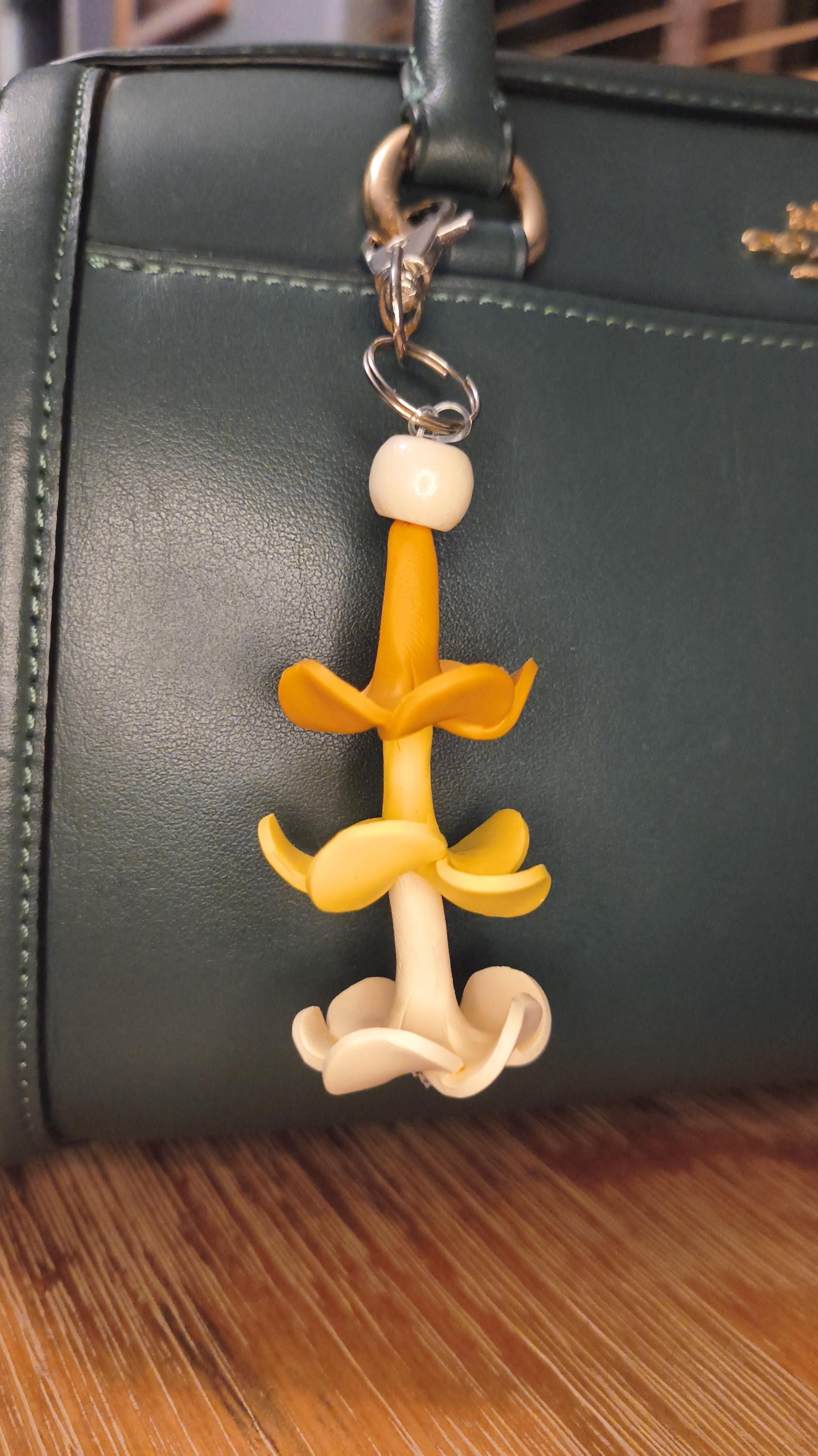 Keychain with handmade clay puakenikeni