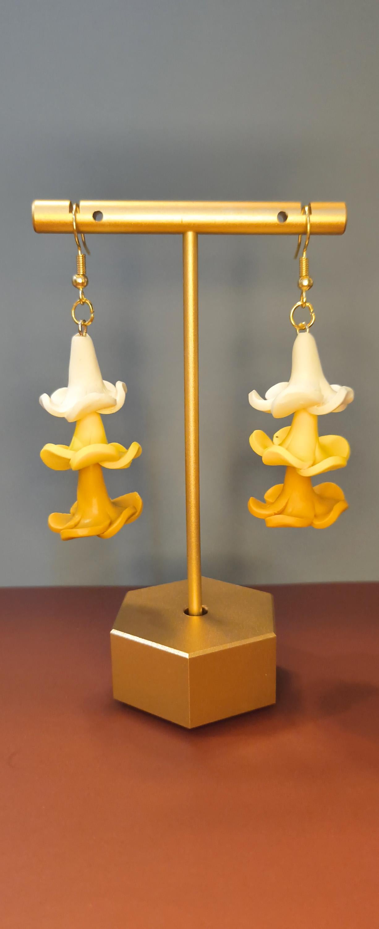 Drop earrings with handmade clay puakenikeni